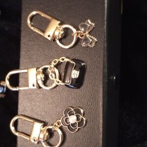 Bag charms 3 adorable black and gold toned new